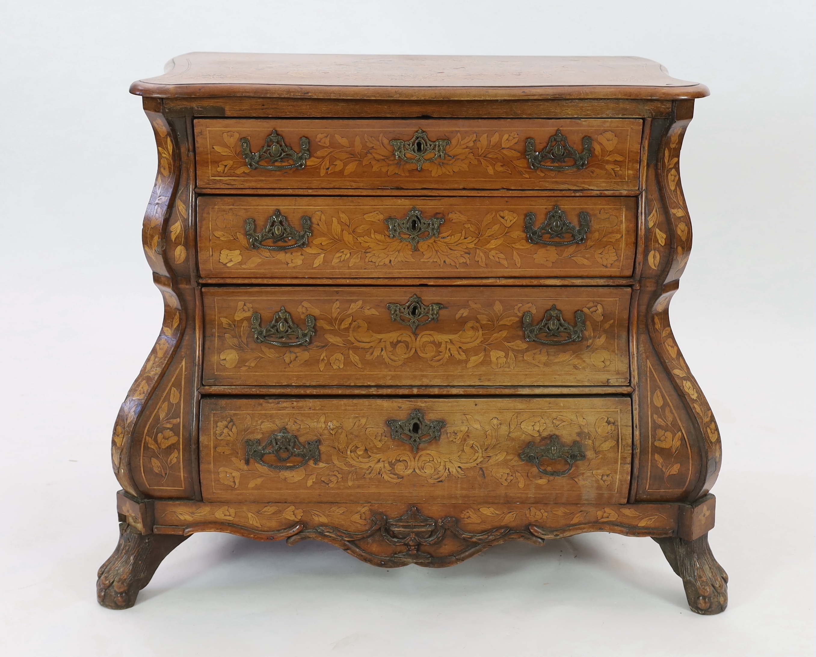 An early 19th century Dutch walnut and marquetry bombé front commode, width 110cm, depth 60cm, height 87cm
